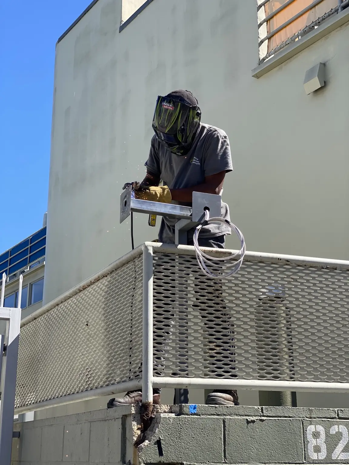 Three Factor Security technician fabricating purpose-built commercial perimeter camera infrastructure — Three Factor Security fieldwork in Los Angeles