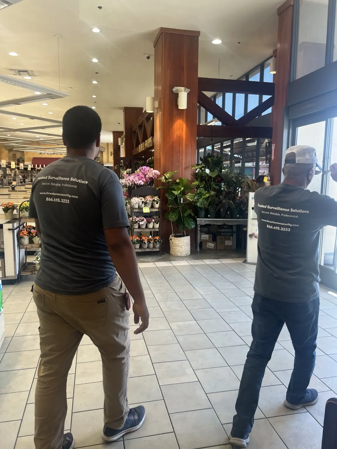 Three Factor Security technicians walking a commercial property during a site assessment