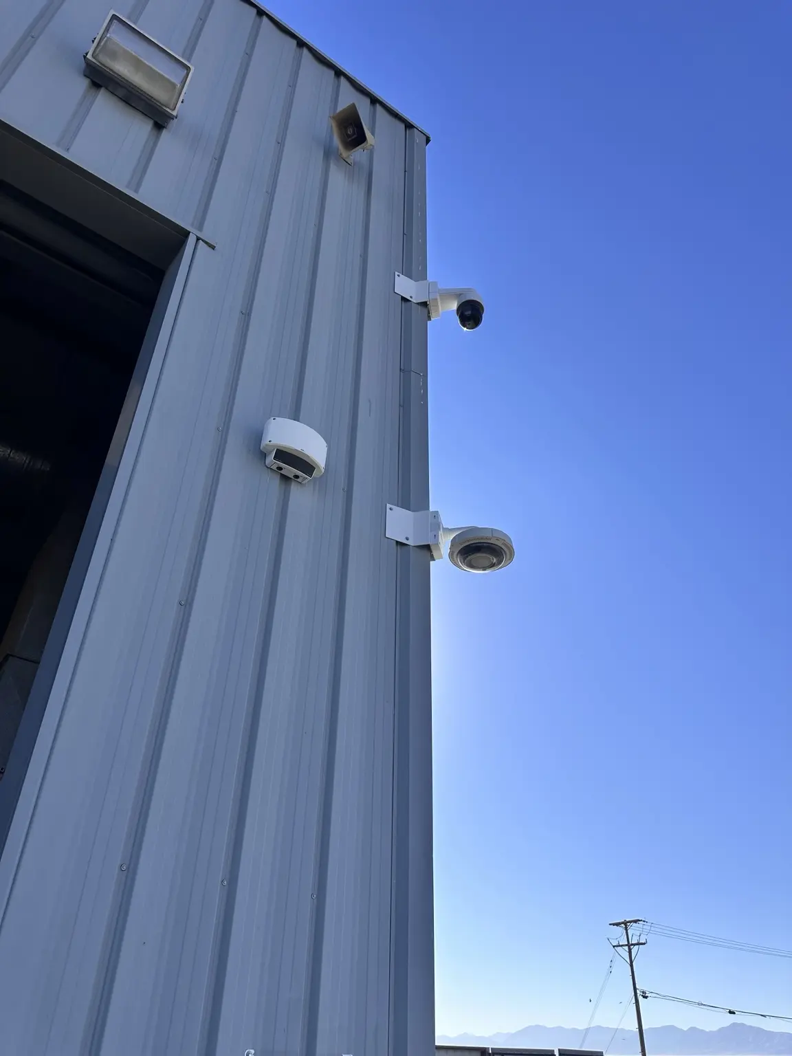 Complete commercial exterior installation combining a PA speaker with cameras and detection devices — Three Factor Security fieldwork in Los Angeles