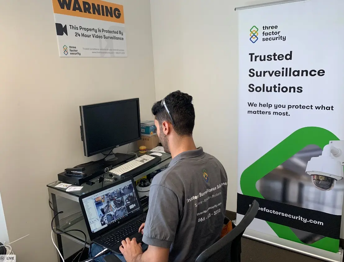 Three Factor Security technician configuring an upgraded security system — Three Factor Security fieldwork in Westlake Village